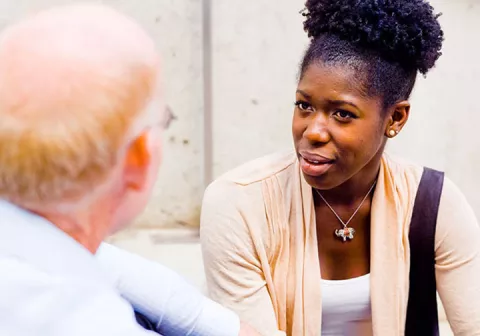 A patient and medical practitioner consult